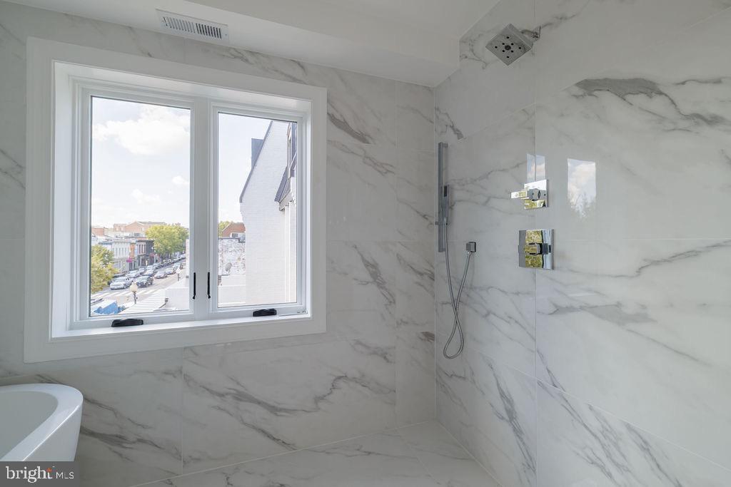 1202 Potomac Street Northwest Washington, DC 20007 - Photo 22 of 37 a bathroom with a bathtub and a shower