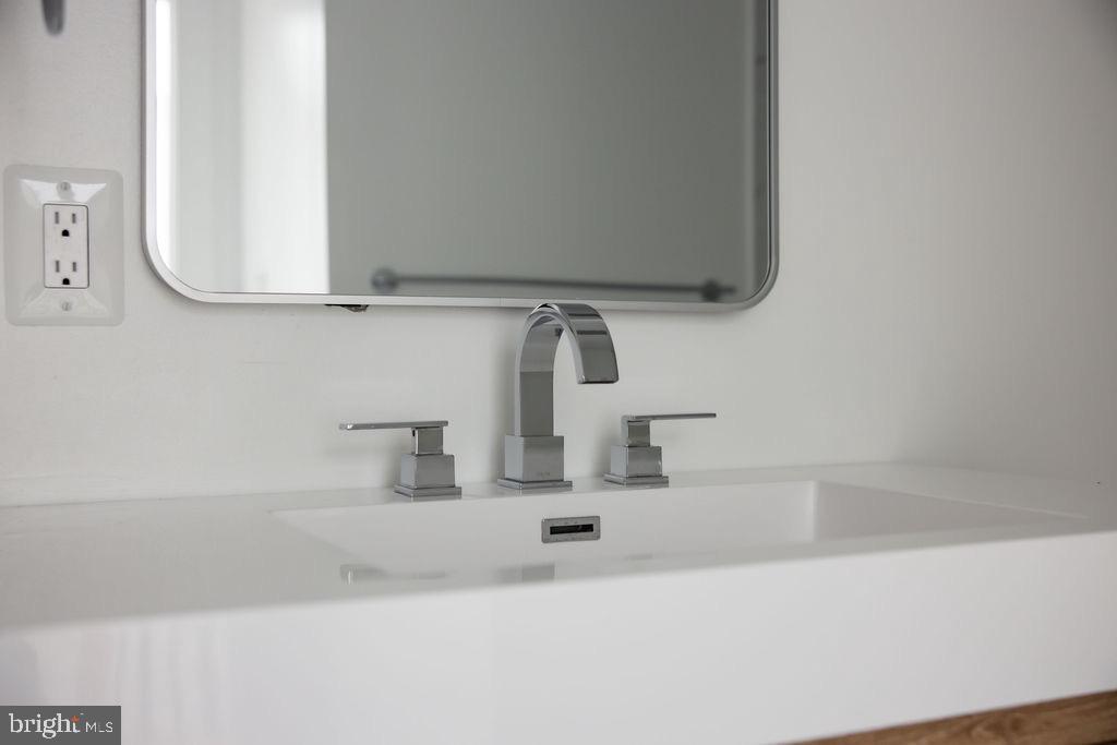 1202 Potomac Street Northwest Washington, DC 20007 - Photo 29 of 37 a bathroom with a sink and a mirror