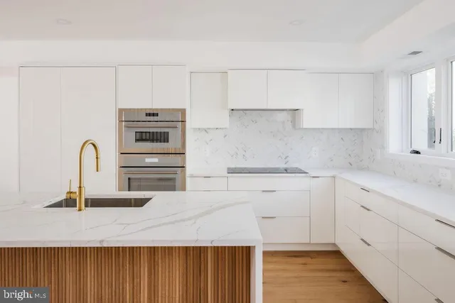 a kitchen with cabinets and appliances