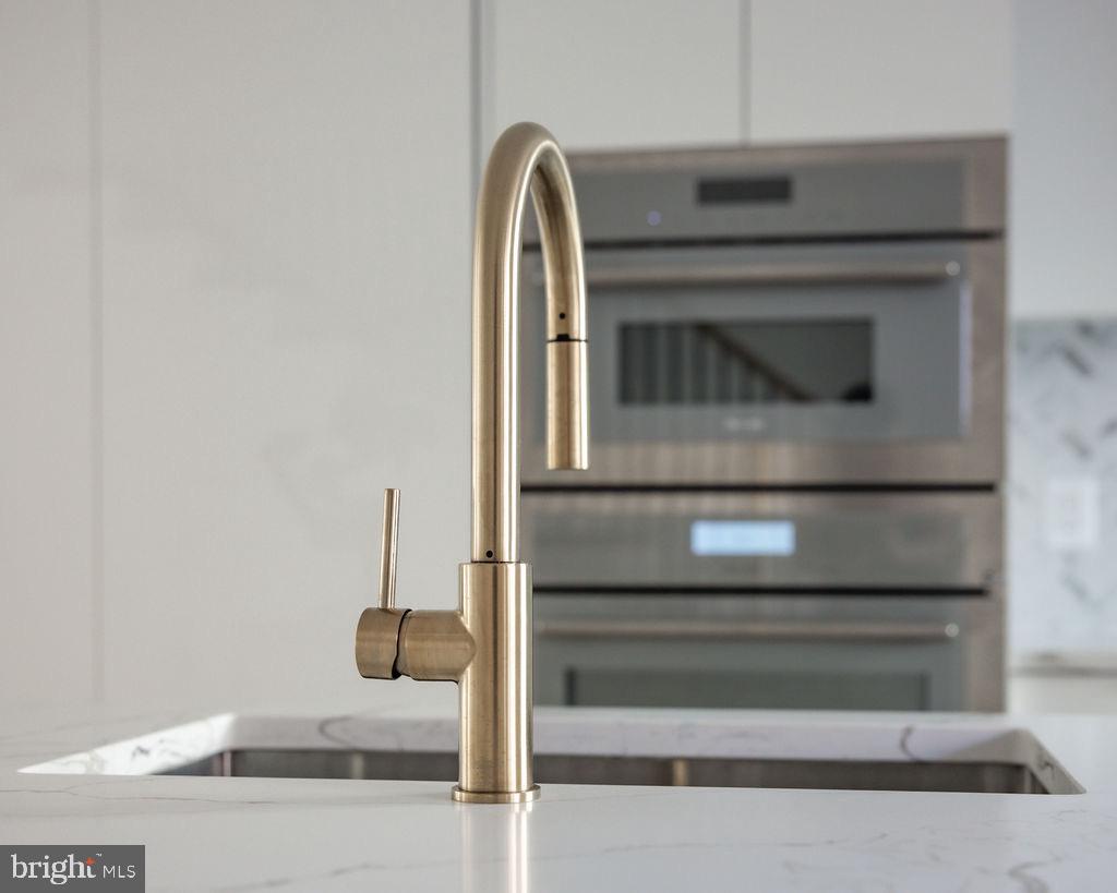 1202 Potomac Street Northwest Washington, DC 20007 - Photo 7 of 37 a bathroom with a sink and mirror