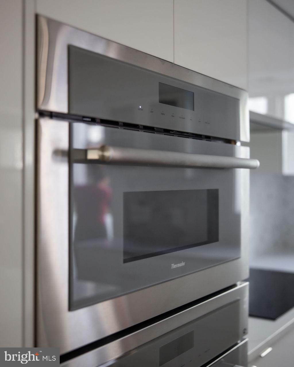 1202 Potomac Street Northwest Washington, DC 20007 - Photo 10 of 37 a kitchen with a stove and a microwave