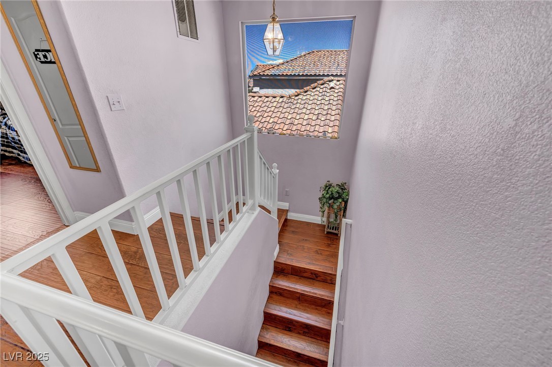 2180 Polynesia Circle Henderson, NV 89074 - Photo 15 of 53 Staircase with wood finished floors and baseboards