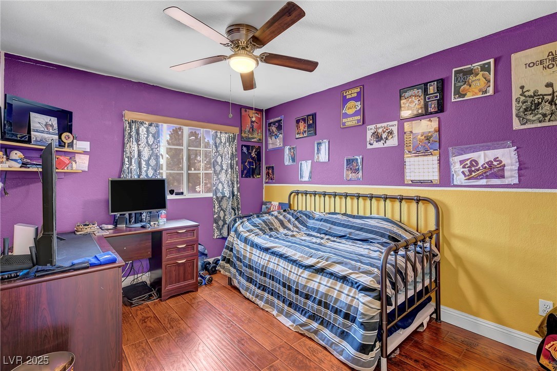 2180 Polynesia Circle Henderson, NV 89074 - Photo 16 of 53 Bedroom with wood-type flooring, a ceiling fan, an