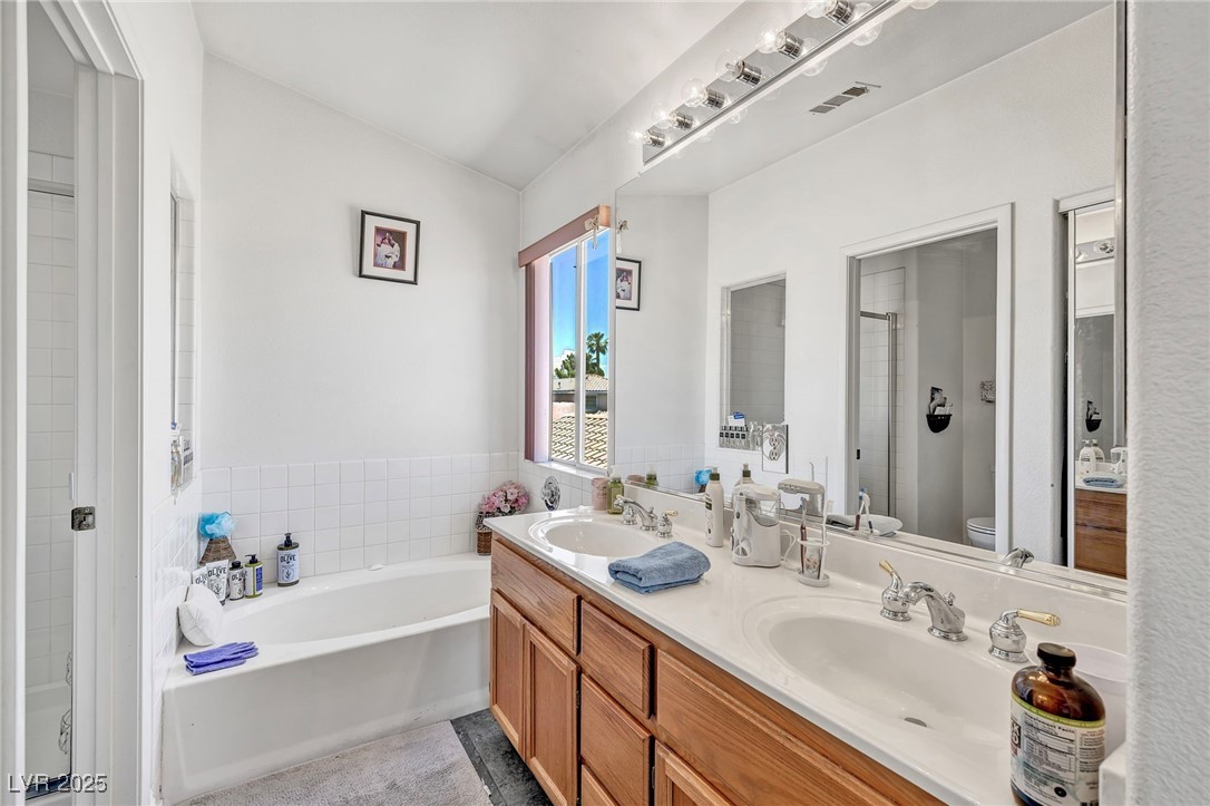 2180 Polynesia Circle Henderson, NV 89074 - Photo 18 of 53 Full bath with toilet, a stall shower, a garden tu