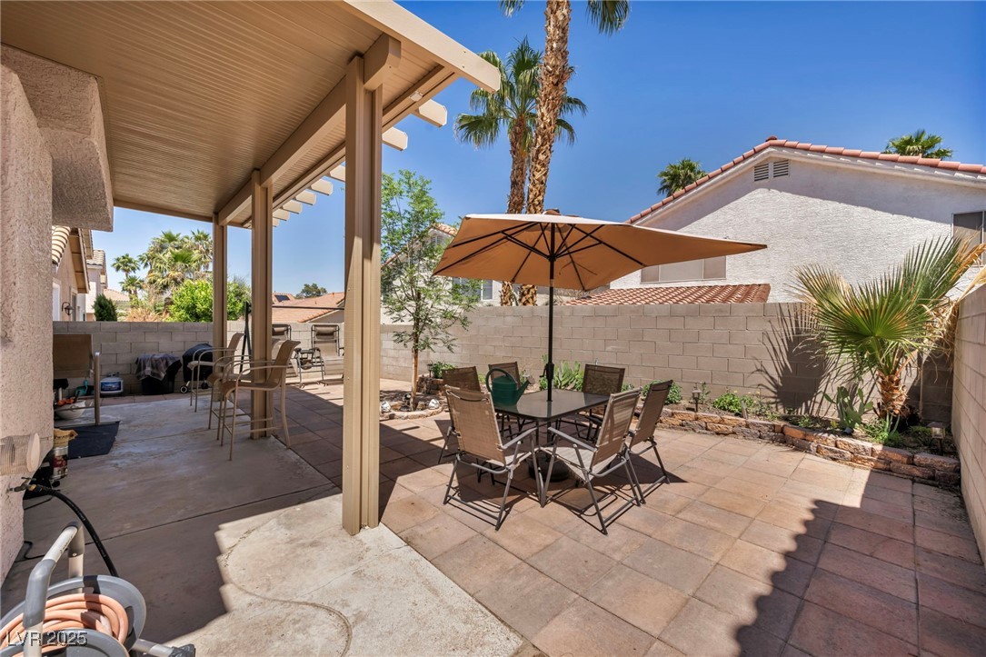 2180 Polynesia Circle Henderson, NV 89074 - Photo 34 of 53 View of patio featuring outdoor dining space and a