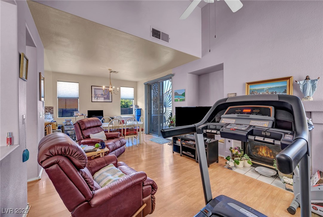 2180 Polynesia Circle Henderson, NV 89074 - Photo 9 of 53 Exercise area featuring a chandelier, wood finishe