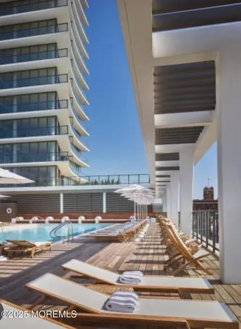 a bedroom with a bed and wall painting on the wall