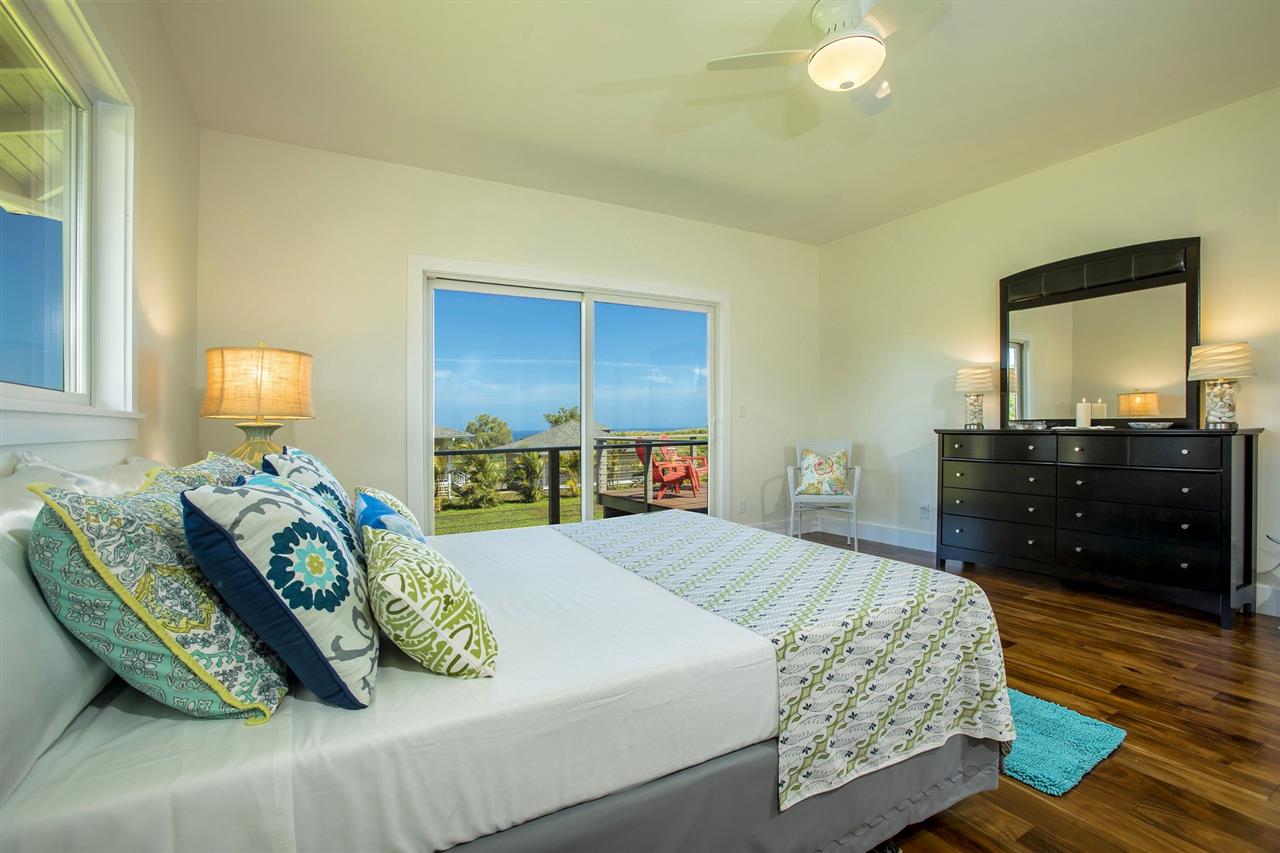 1351 Hookili Road, Unit A Haiku, HI 96708 - Photo 12 of 29 a bedroom with a bed and a dresser