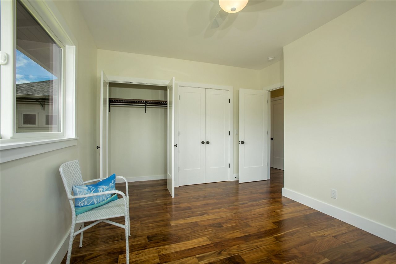 1351 Hookili Road, Unit A Haiku, HI 96708 - Photo 21 of 29 a view of room with furniture and wooden floor