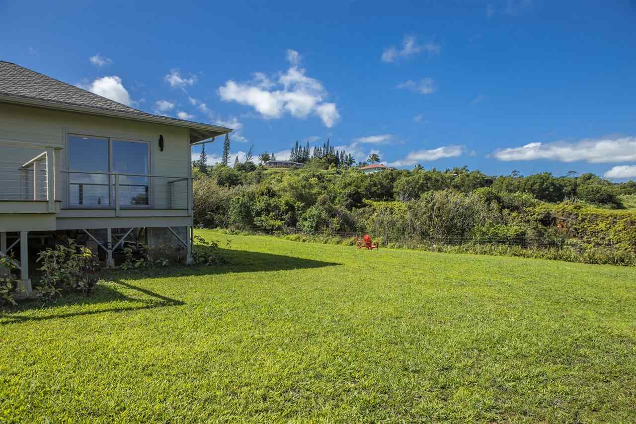 1351 Hookili Road, Unit A Haiku, HI 96708 - Photo 26 of 29 a view of a backyard with plants and a patio