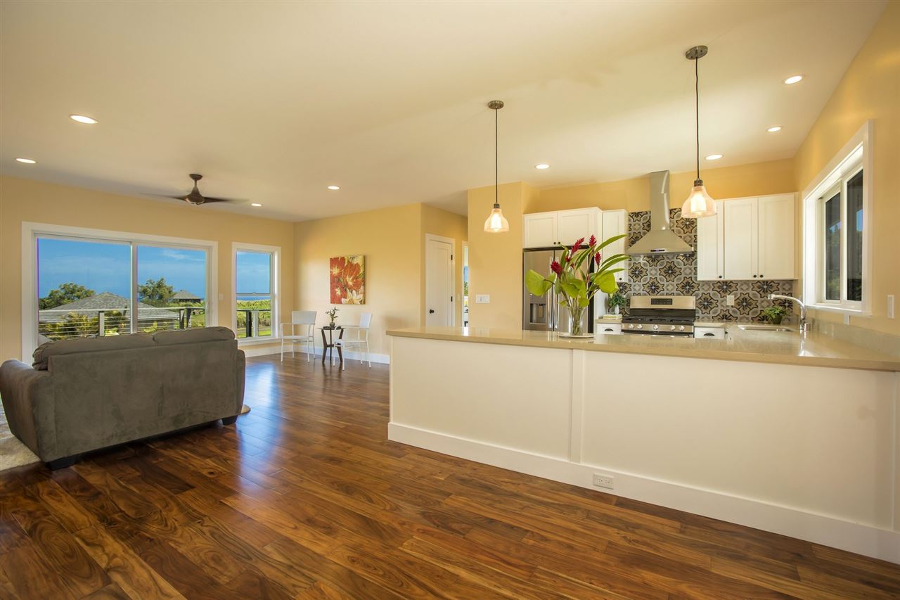 1351 Hookili Road, Unit A Haiku, HI 96708 - Photo 2 of 29 a view of a living room and kitchen with stainless steel appliances granite countertop furniture