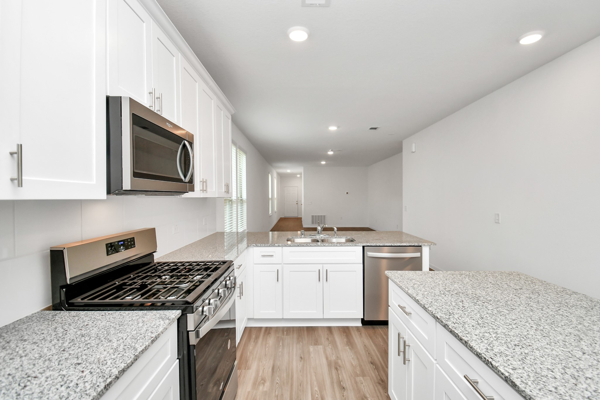 16150 Elbridge Court Conroe, TX 77302 - Photo 10 of 46 Another view of this well thought out kitchen.