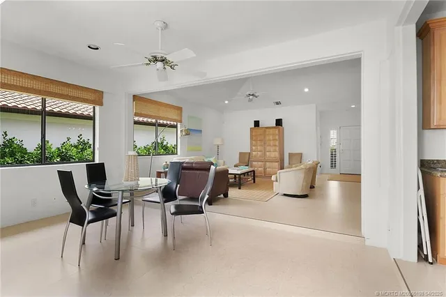 a spacious en suite bathroom with a double vanity sink a mirror and shower