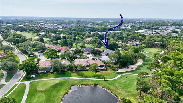 a view of a garden with a building in the background