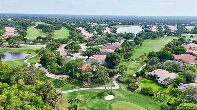 a view of a garden with a building in the background