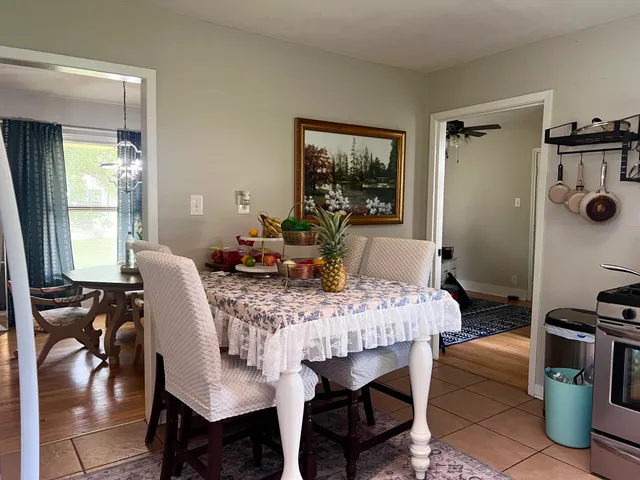 a dining room with furniture and window