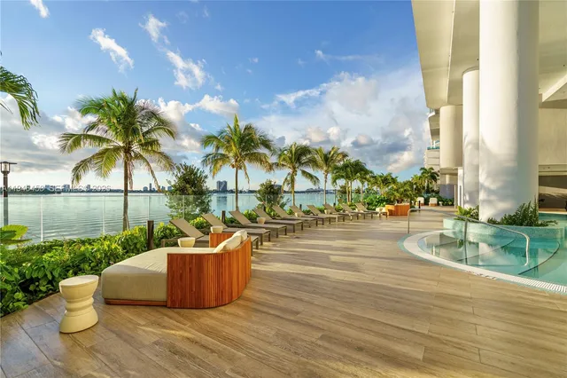 a view of a swimming pool with a lounge chairs