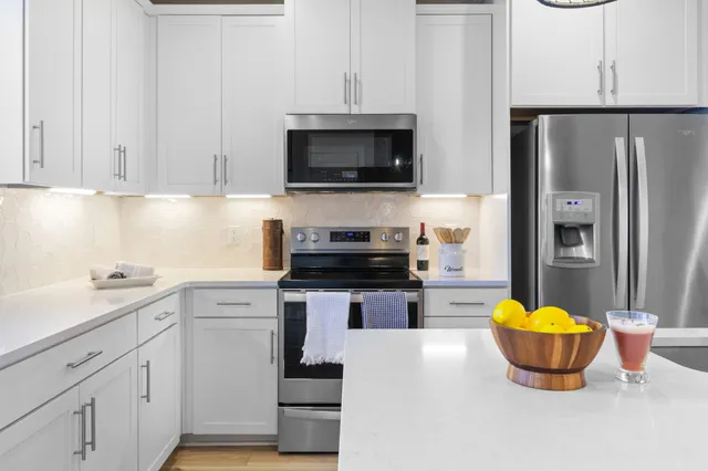 a kitchen with a sink and a stove