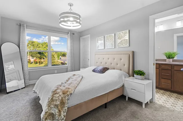 a bathroom with a granite countertop sink a shower and a mirror