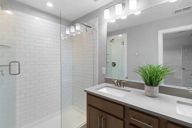 a bedroom with a bed a couch and a window