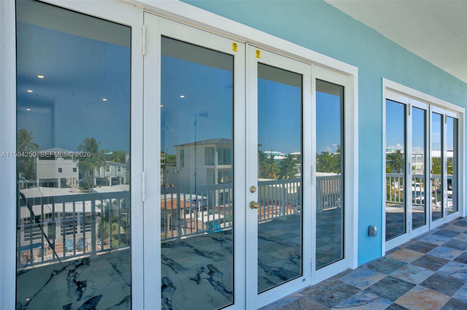 84 Coral Way Key Largo, FL 33037 - Photo 28 of 55 a bathroom with a glass door shower and a sink