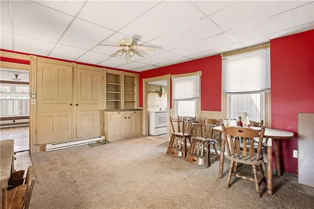 a view of a livingroom with furniture and window