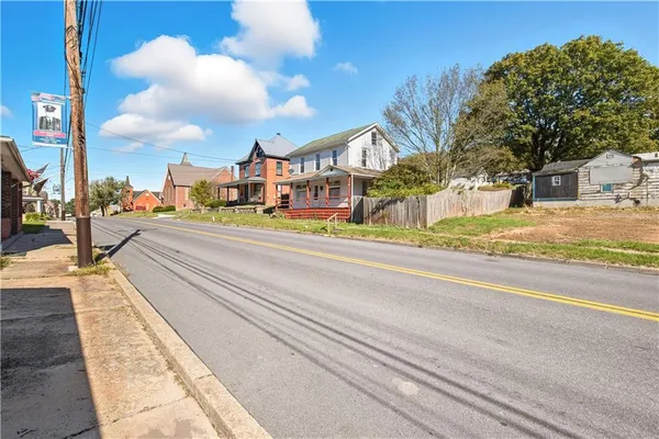 a view of a street with houses