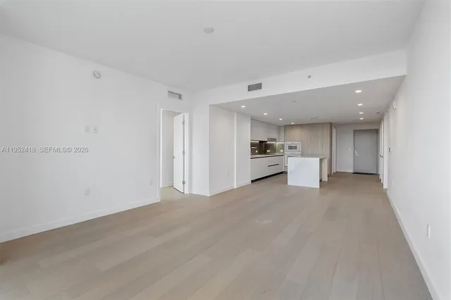 a large kitchen with a large window