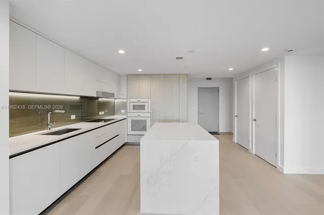 a close view of a utility room with dryer and washer