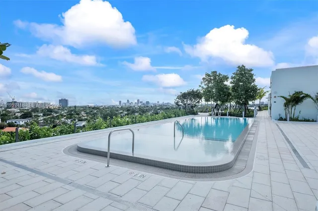 a room with gym equipment and a table