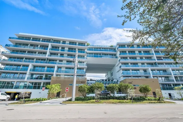 a kitchen with stainless steel appliances a refrigerator and a stove
