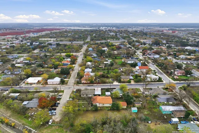 an aerial view of residential houses with outdoor space