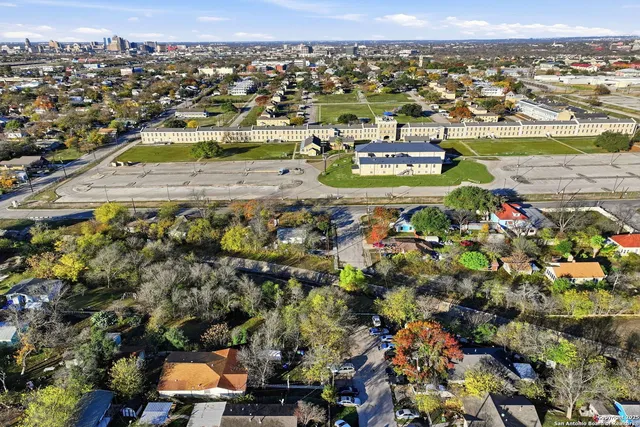an aerial view of residential houses with outdoor space