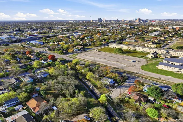 an aerial view of residential houses with outdoor space
