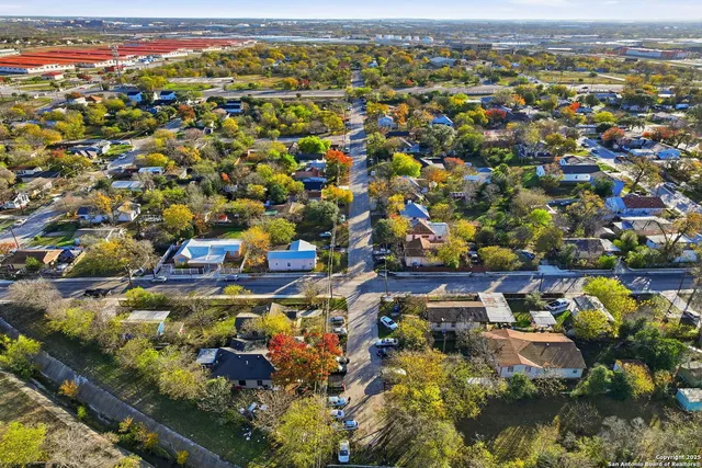 an aerial view of residential houses with outdoor space