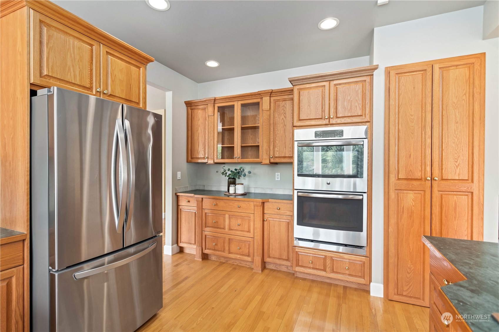 633 Kline Road Bellingham, WA 98226 - Photo 8 of 40 a kitchen with stainless steel appliances granite countertop a refrigerator and a stove top oven