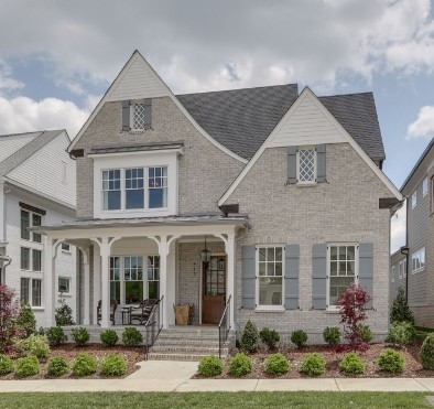 front view of a house with a yard
