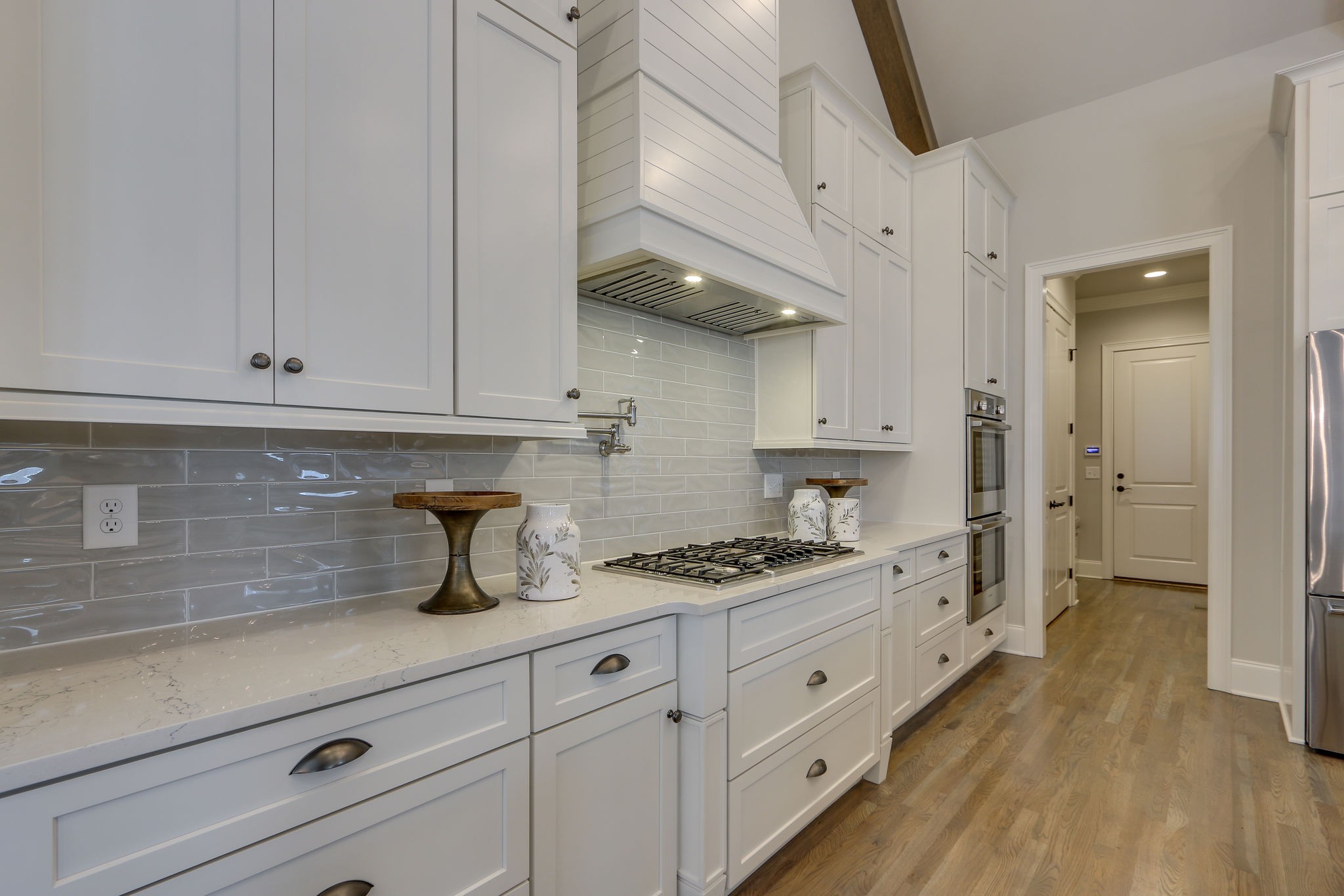 513 Rowan Street Franklin, TN 37064 - Photo 11 of 36 a kitchen with white cabinets and white appliances