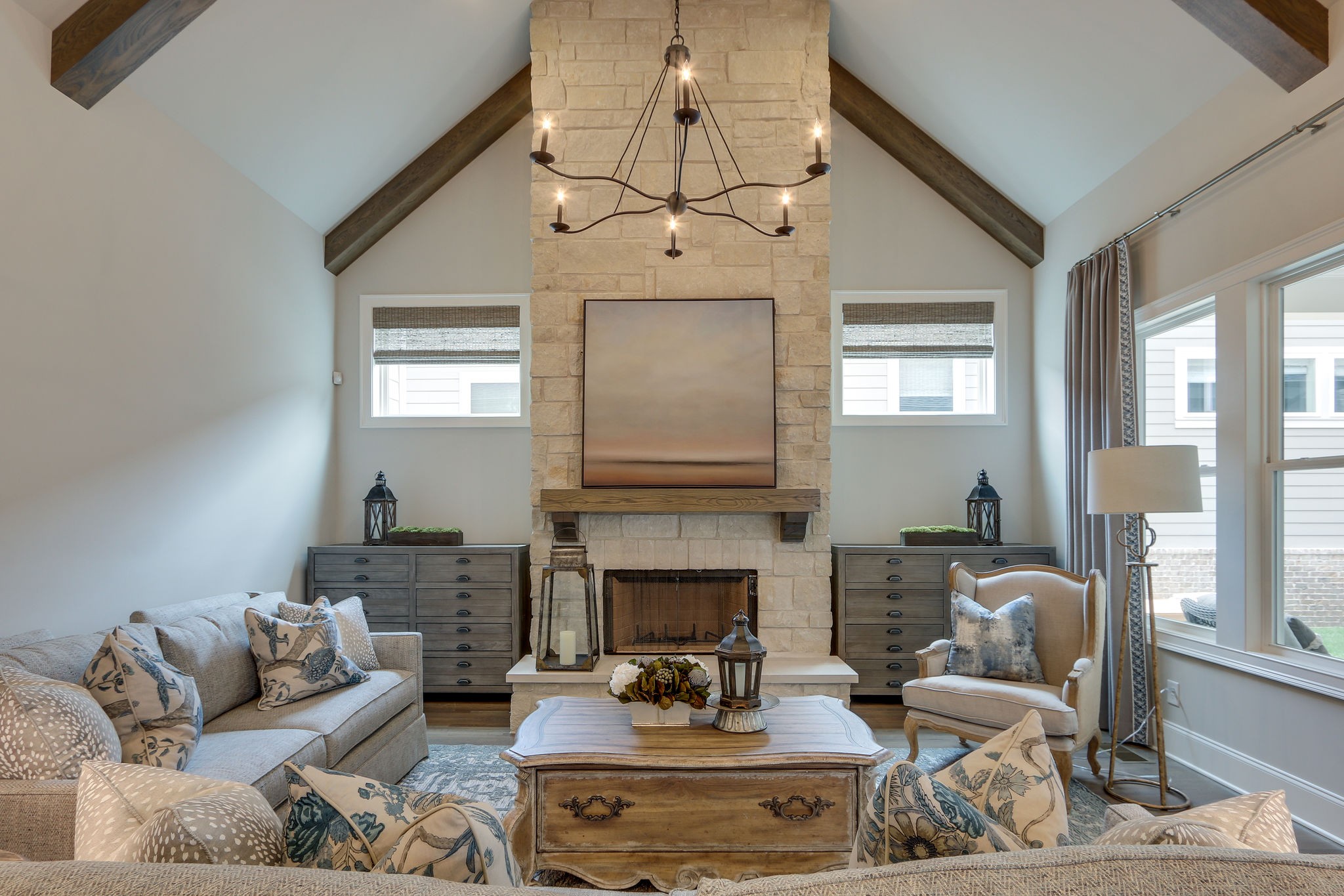 513 Rowan Street Franklin, TN 37064 - Photo 13 of 36 a living room with furniture a fireplace and a chandelier
