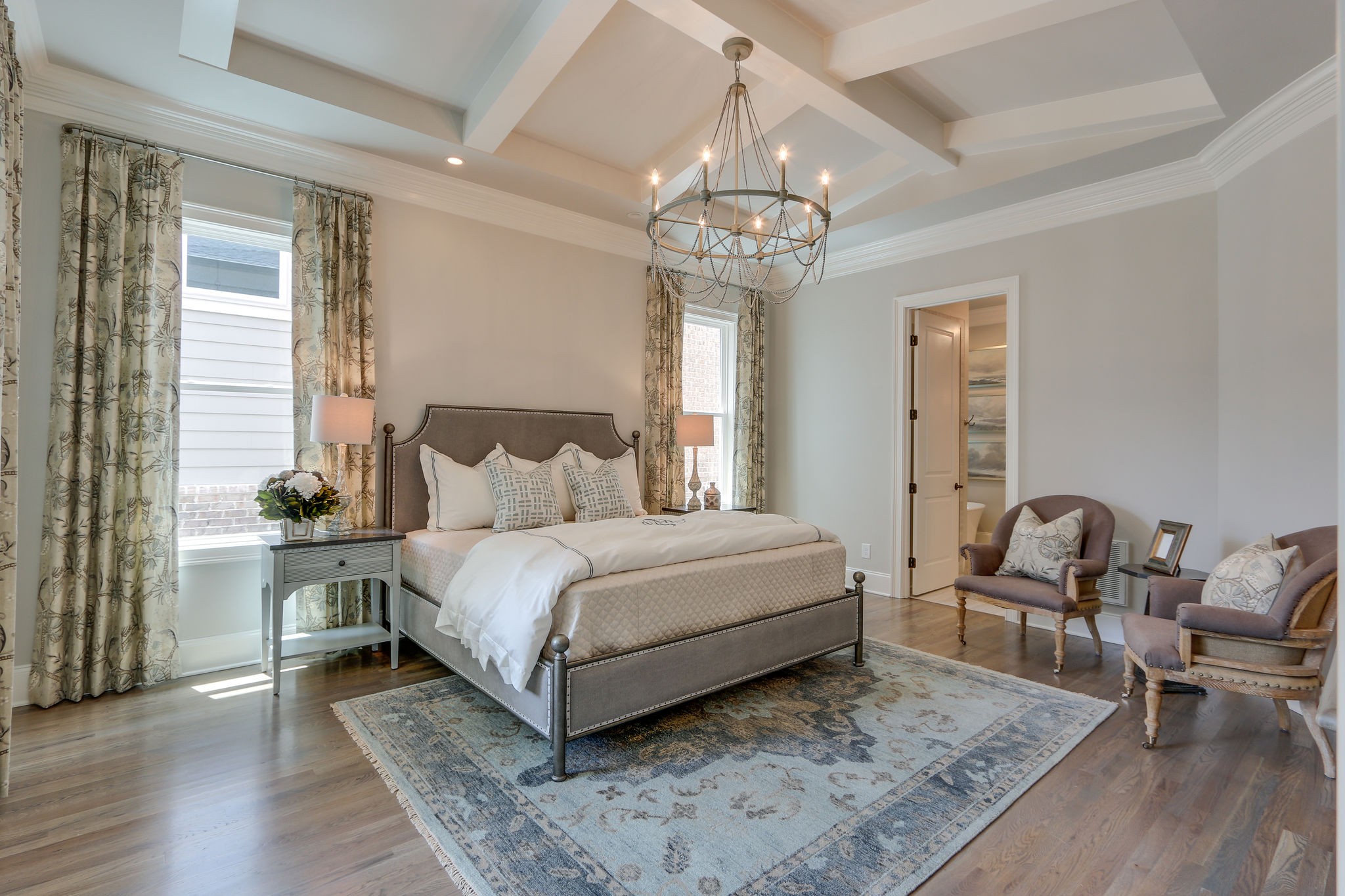 513 Rowan Street Franklin, TN 37064 - Photo 15 of 36 a spacious bedroom with a bed and a table in it