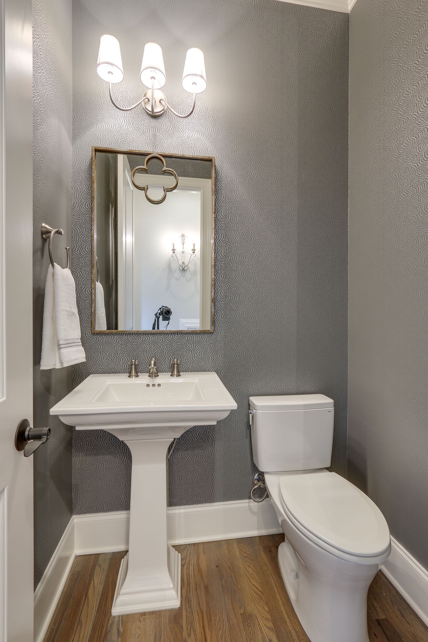 513 Rowan Street Franklin, TN 37064 - Photo 22 of 36 a bathroom with a toilet sink and mirror