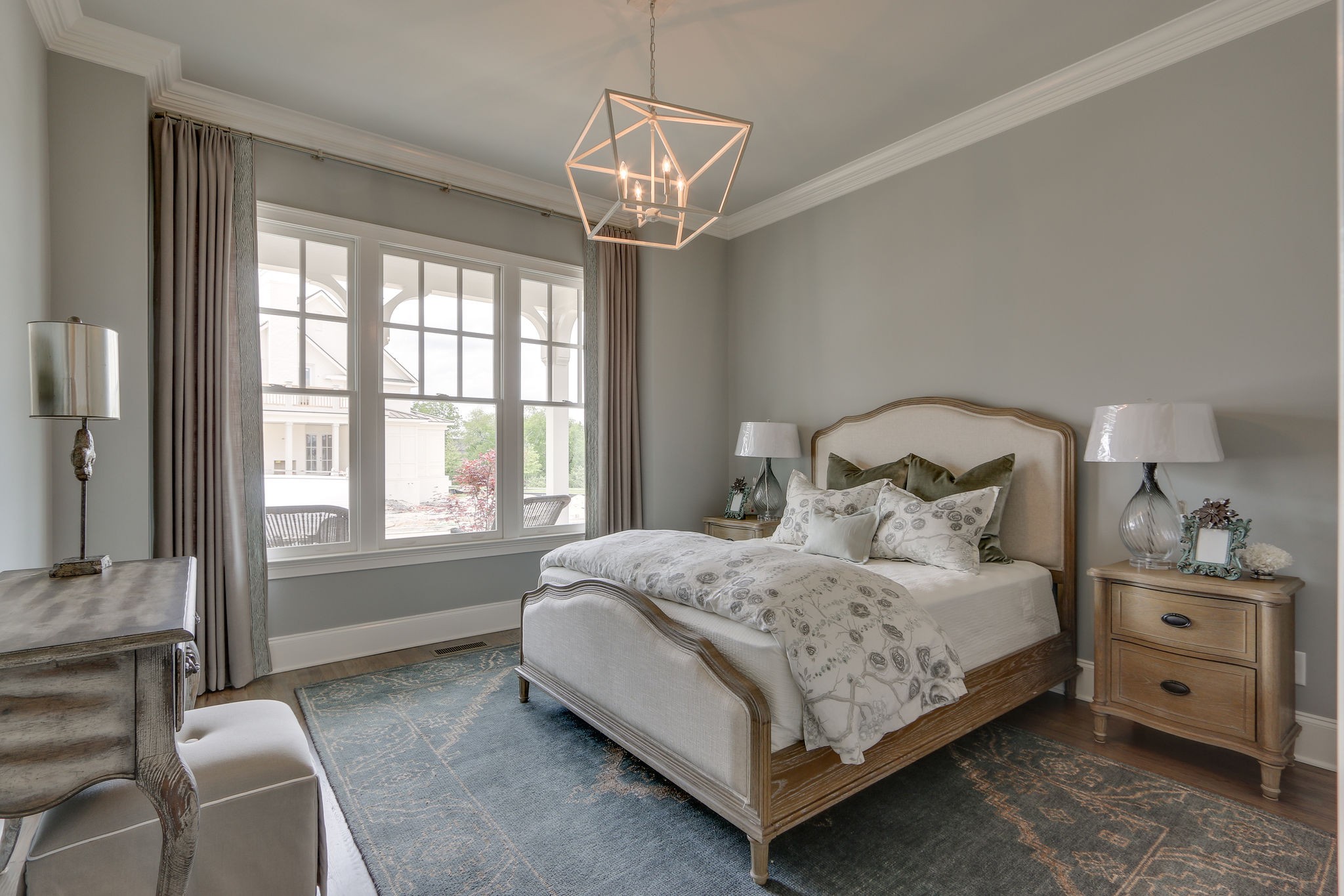 513 Rowan Street Franklin, TN 37064 - Photo 23 of 36 a bedroom with a bed and a chandelier