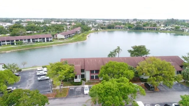 an aerial view of a house with a lake view