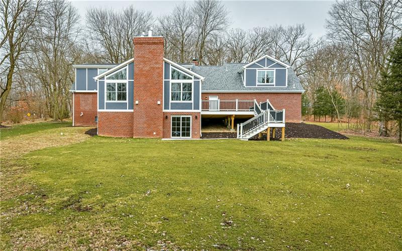 309 Parkhill Road Baden, PA 15005 - Photo 23 of 25 This huge 20' x 20' composite deck with access from both the great room and pantry room feature terraced staircase that lead down to concrete patio and park like back yard.