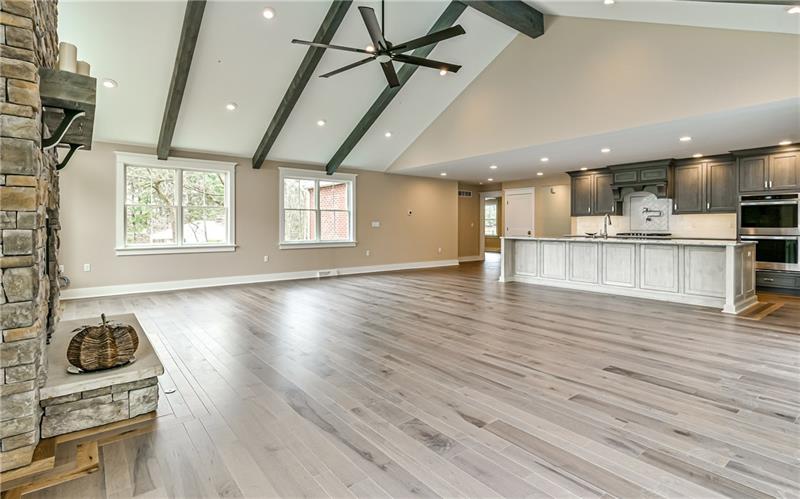 309 Parkhill Road Baden, PA 15005 - Photo 8 of 25 Walls of windows allow relaxation while taking in the scenic view in this great room featuring high wood beamed vaulted ceiling, large ceiling fan, recessed lighting and surround sound speakers