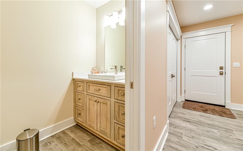 309 Parkhill Road Baden, PA 15005 - Photo 10 of 25 Main level powder room with pocket door conveniently located off of laundry/mud room.