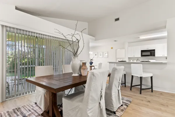 a kitchen with a sink and a stove top oven