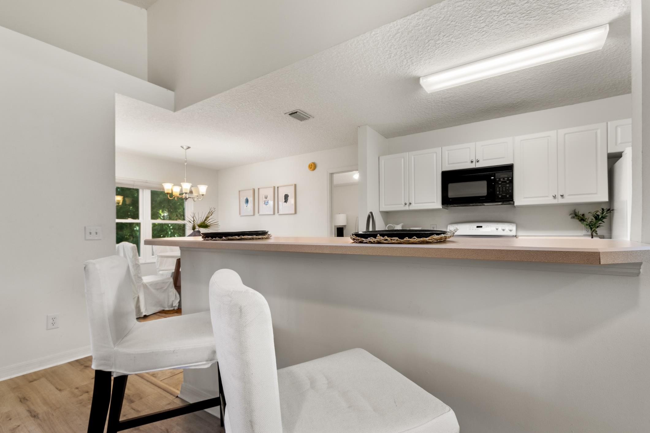 541 Peninsula Court St. Augustine, FL 32080 - Photo 26 of 63 a dining room with furniture and a floor to ceiling window