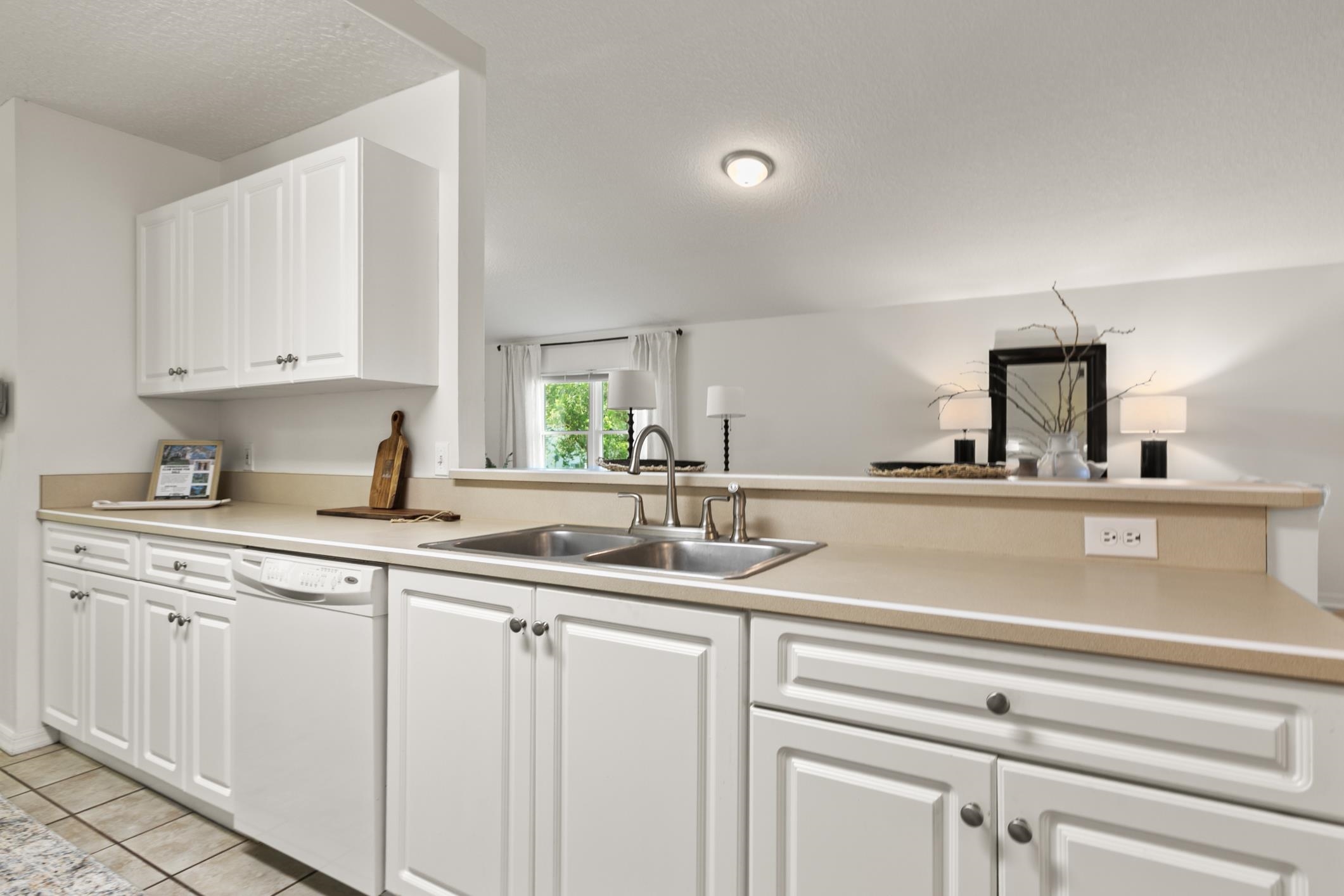 541 Peninsula Court St. Augustine, FL 32080 - Photo 30 of 63 a kitchen with cabinets appliances a sink and a window