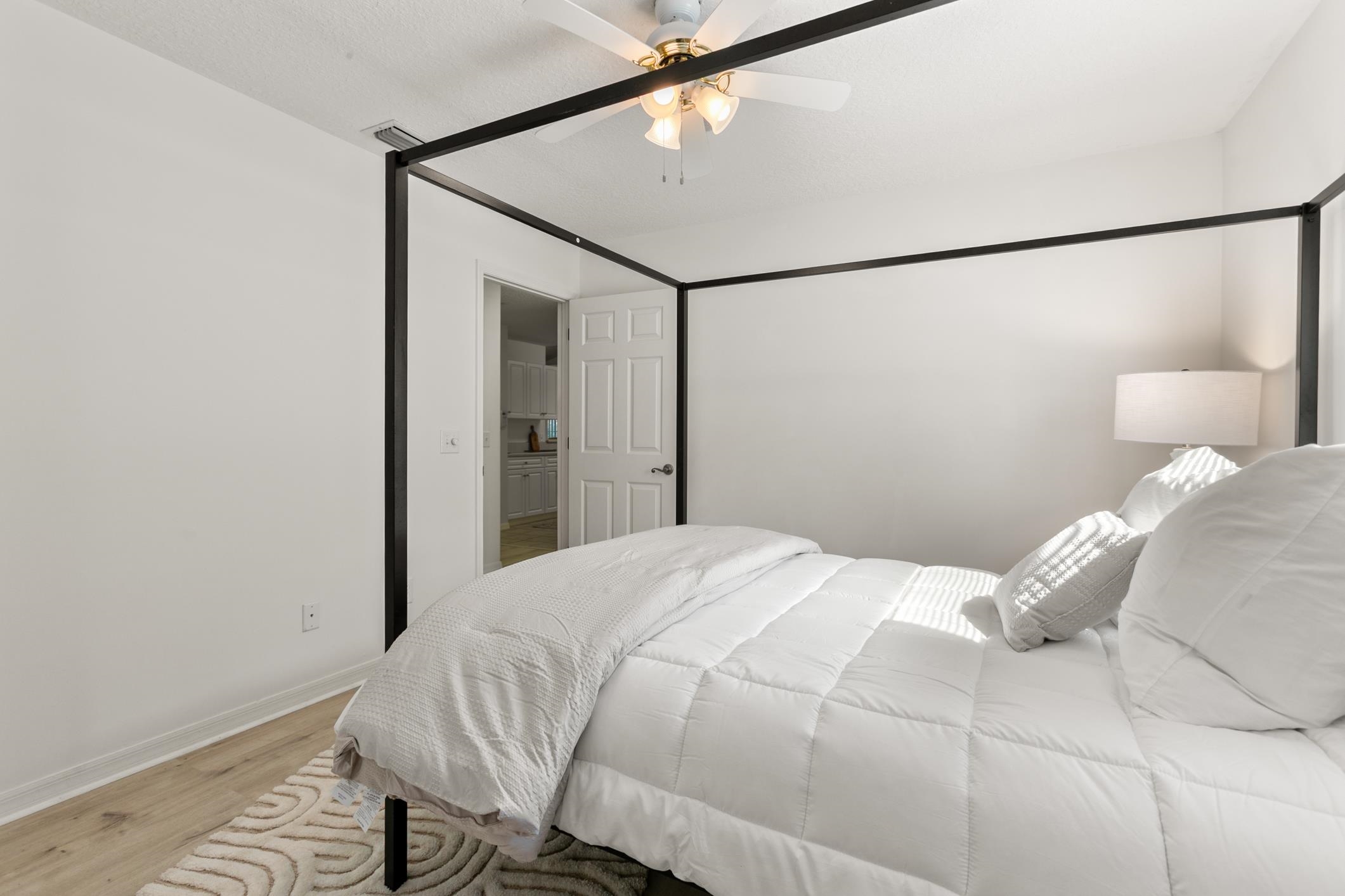 541 Peninsula Court St. Augustine, FL 32080 - Photo 46 of 63 a bedroom with a bed and a mirror